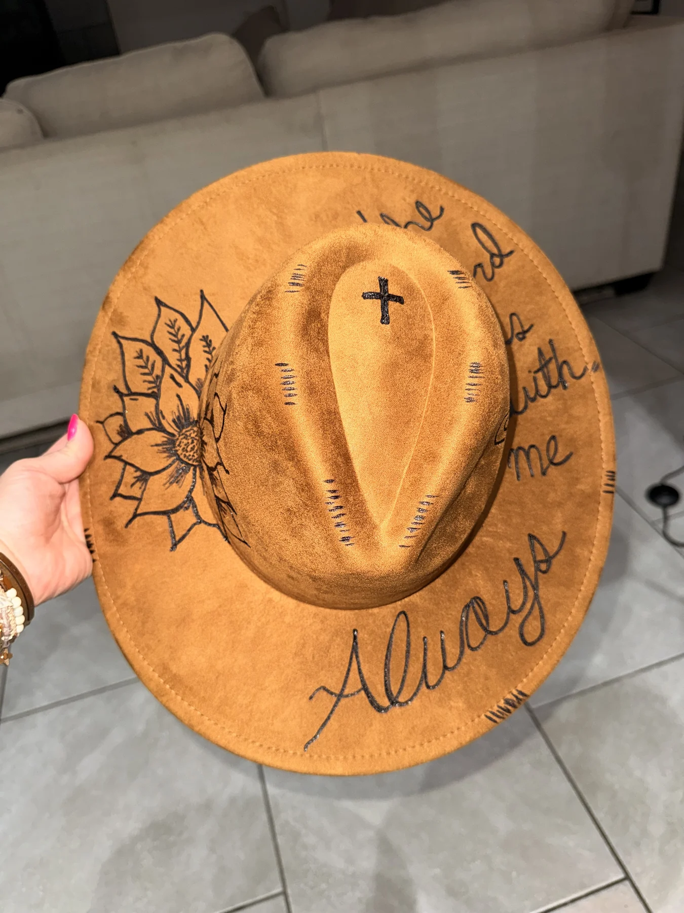 Golden amber wide-brim hat with sunflower and cross etching